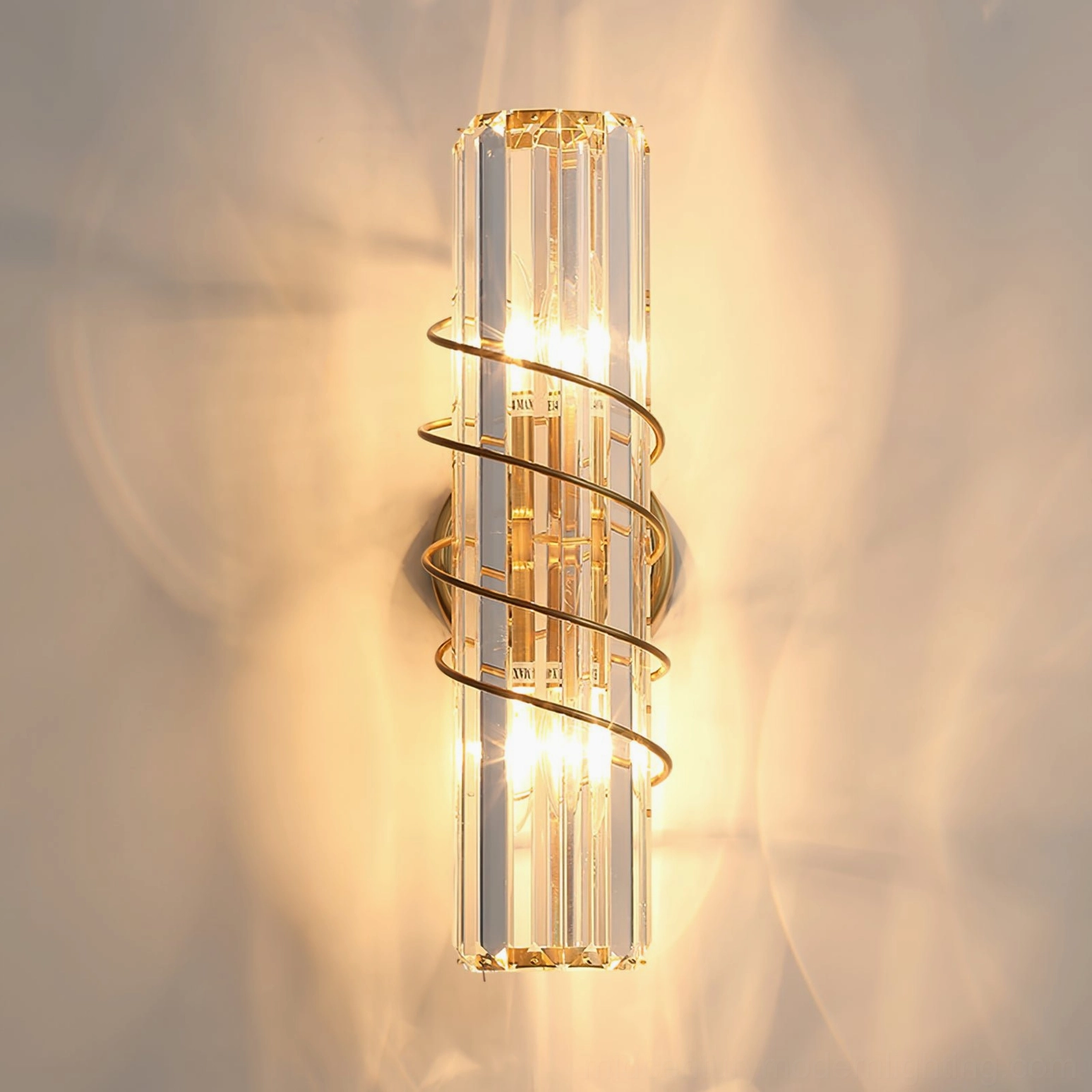 Bonnington crystal wall sconce with warm light glowing through brass and crystal components