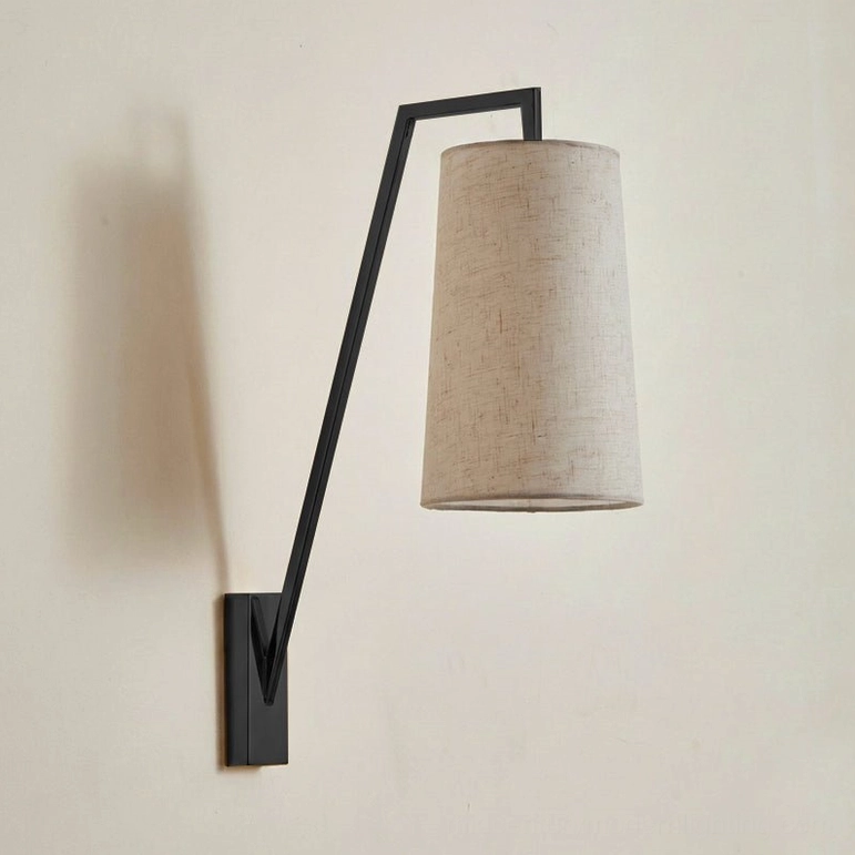 Matte black Bonny wall lamp with industrial minimalist design, tapered beige linen shade, contemporary architectural sconce
