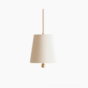 Bonny mid-century modern pendant lamp with tapered linen fabric shade and brass finial detail, studio front view