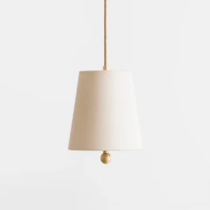 Close-up view of Bonny pendant lamp showing fabric texture and brass hardware, minimalist mid-century design