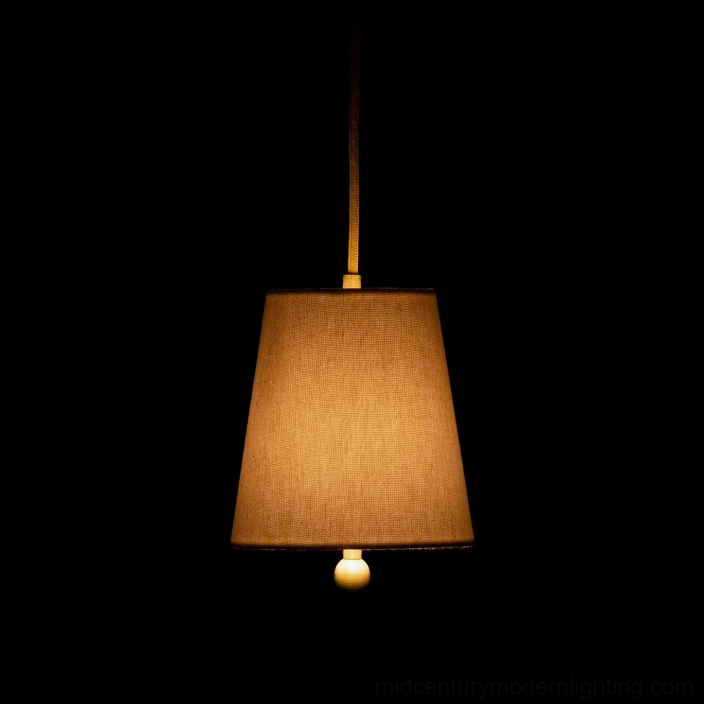 Illuminated Bonny pendant lamp emitting warm amber glow, demonstrating lighting quality and ambiance
