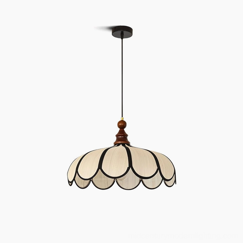Botan scalloped pendant light with beige abaca fiber shade and black petal trim, walnut wood ceiling cap, studio front view