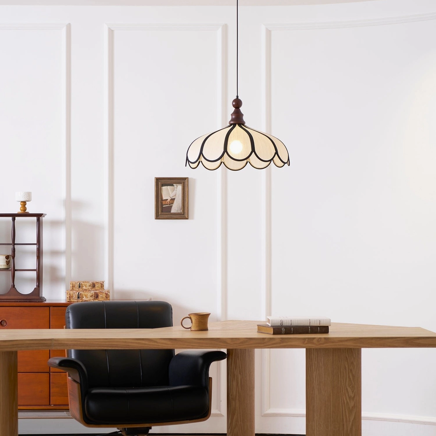 Botan scalloped pendant light in home office setting above wooden desk, mid-century modern interior design