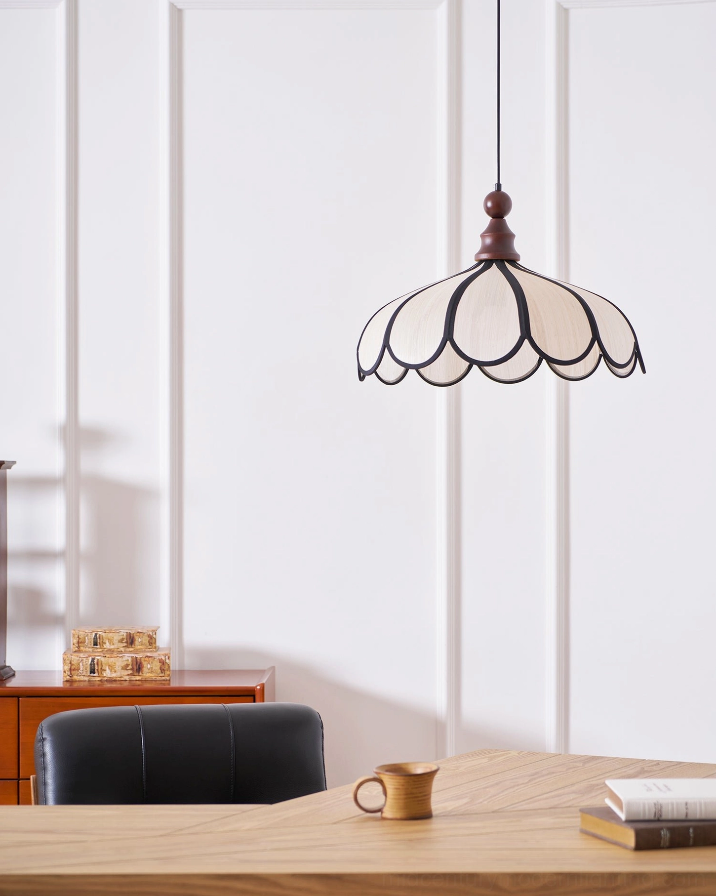 Botan scalloped pendant light against white paneled wall, minimalist vintage lighting design