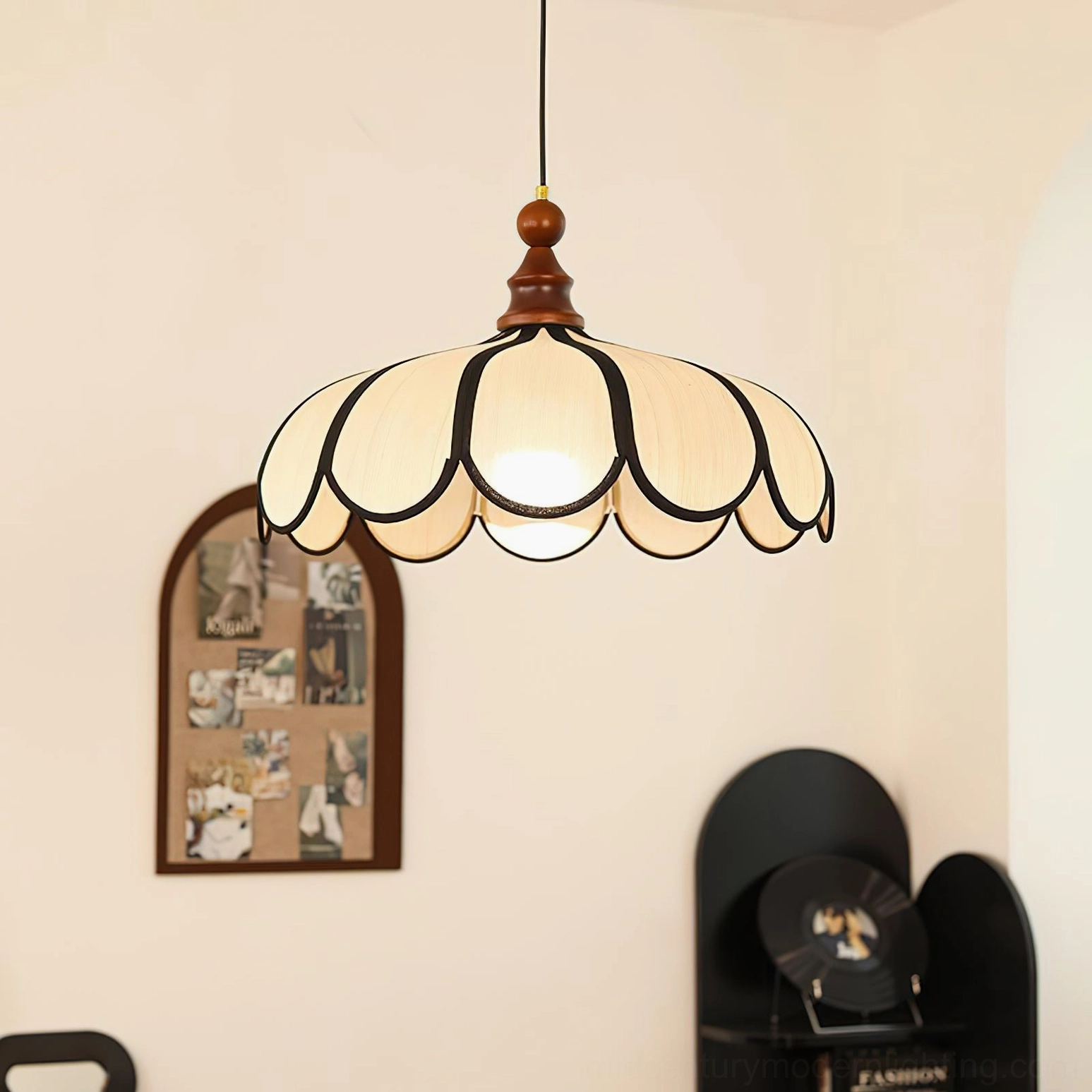 Close-up detail of Botan pendant light scalloped shade with black petal outline trim, handwoven abaca texture
