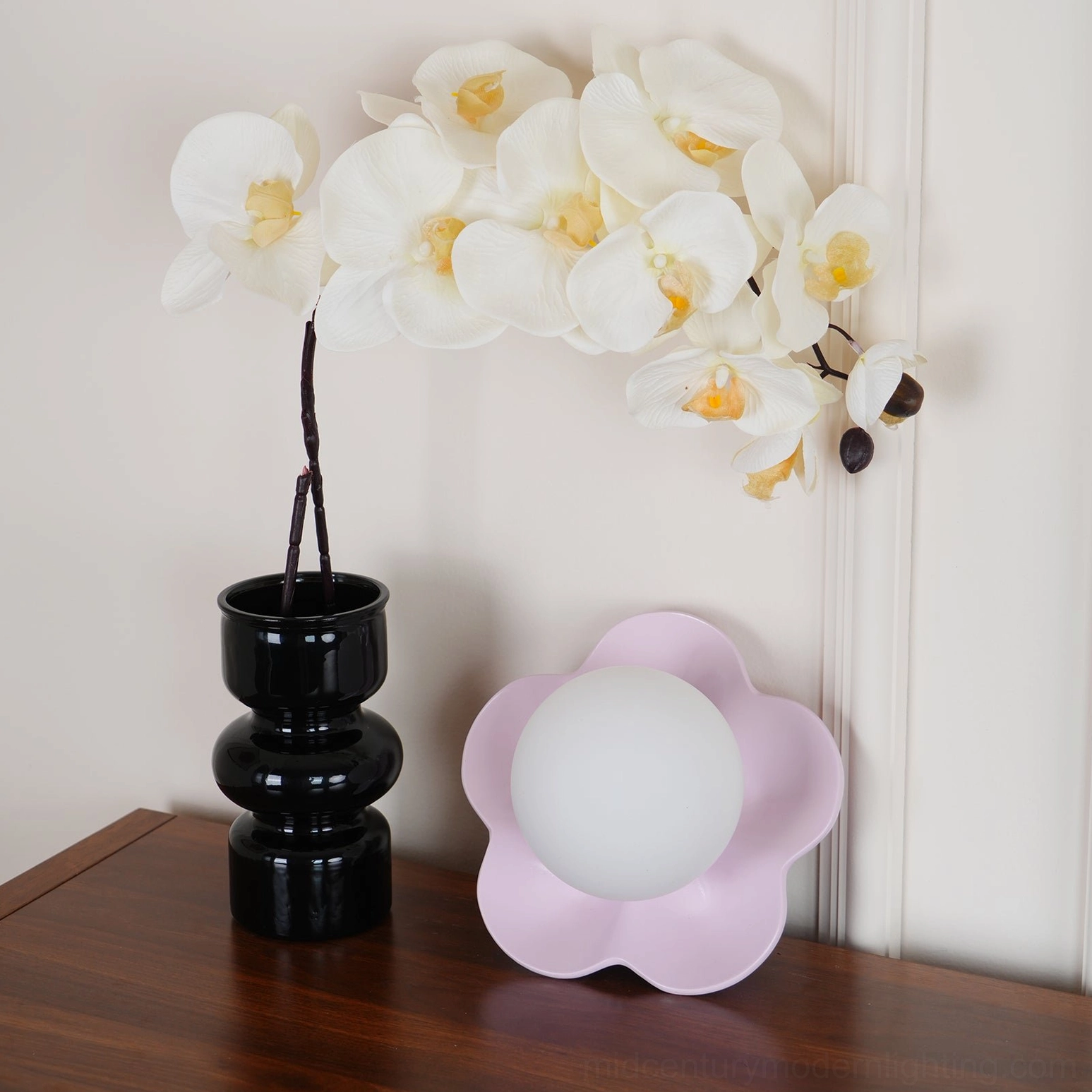 Contemporary botanical wall sconce with frosted glass diffuser warm ambient lighting