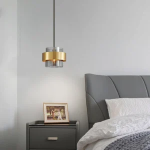 Gold and smoke gray Botello pendant fixture in modern bedroom interior design setting