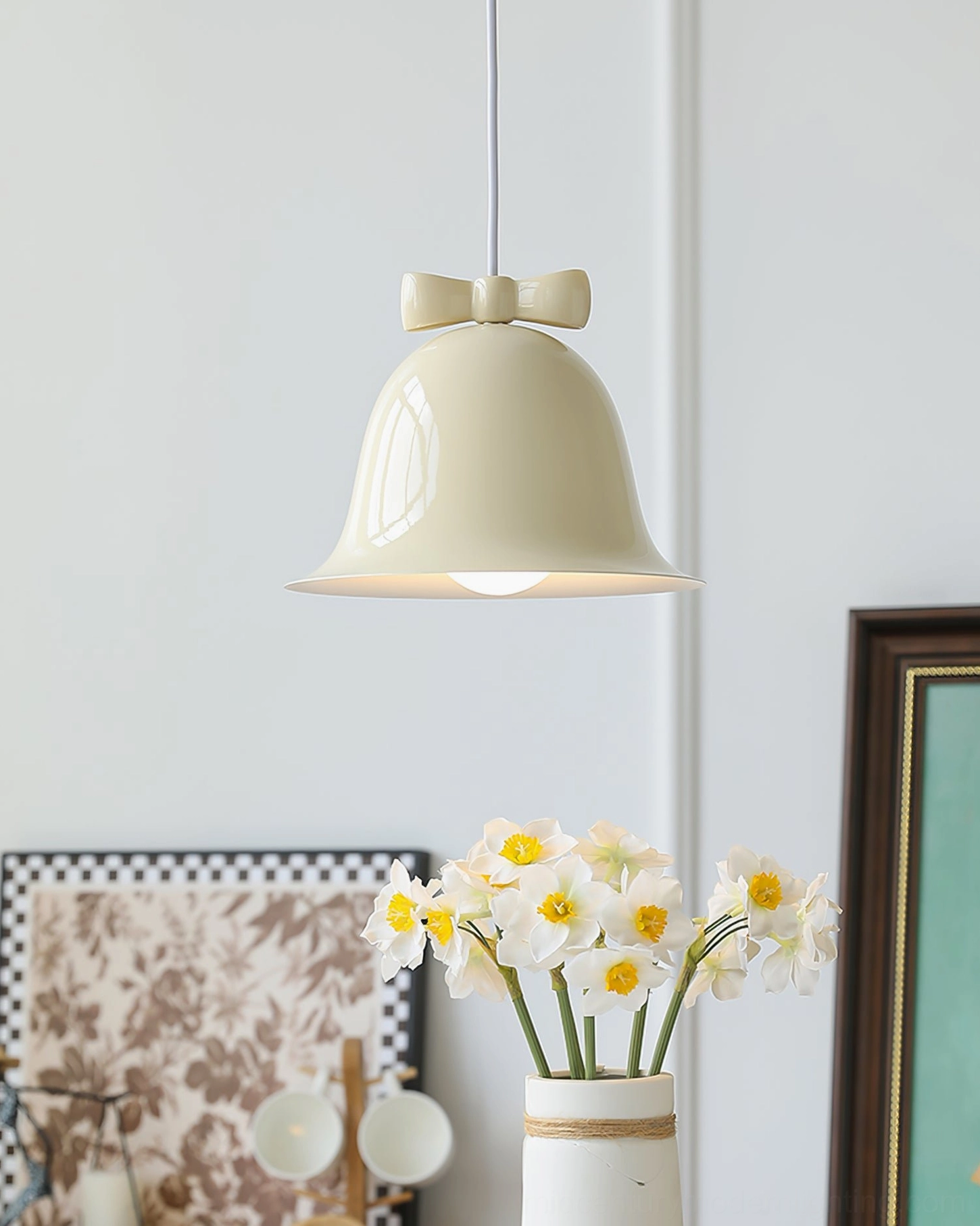 Cream beige bow bell pendant lamp close-up showing sleek minimalist design details