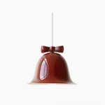 Bow bell pendant lamp with wine-red resin shade and brown decorative bow, studio frontal view