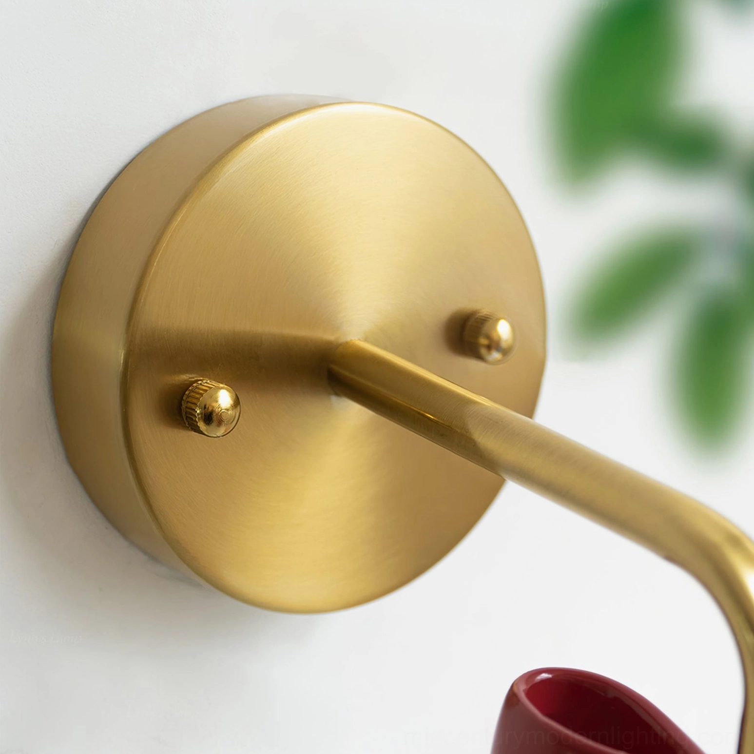 Bow Bell Wall Lamp detail view showing brass metal mount and structural design