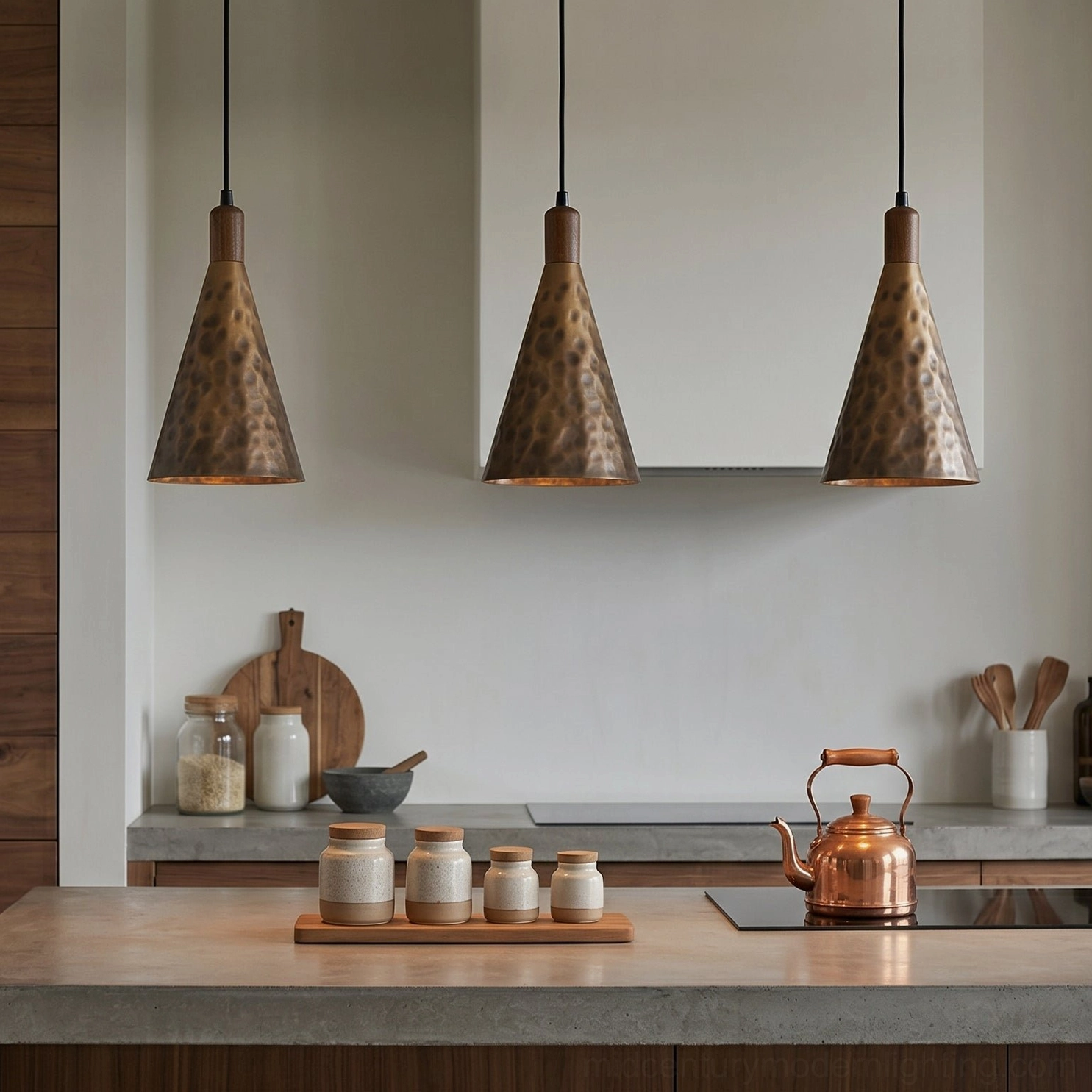 Three Boyd brass pendant lamps grouped over kitchen island modern rustic interior design installation
