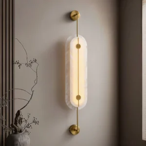 Modern alabaster wall lamp installed on accent wall with contemporary minimalist decor and warm lighting glow
