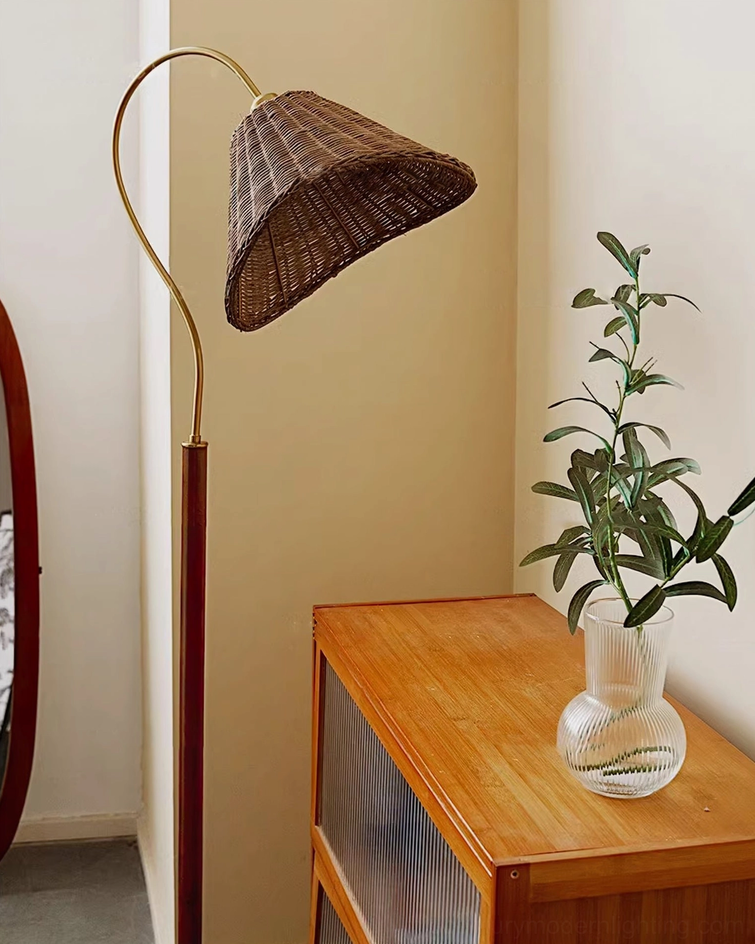 Brady floor lamp in bedroom corner with home decor accessories, glass vase with green plant creating layered interior design
