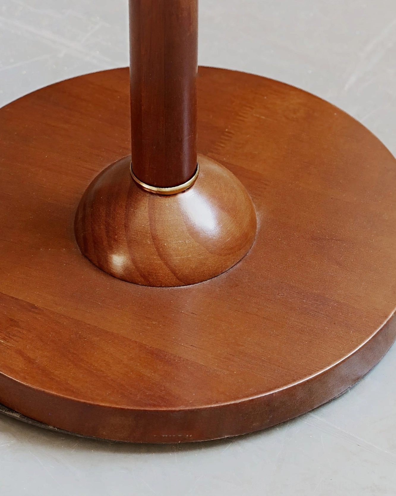 Brady floor lamp base and stand pole featuring solid wood round base with polished brass ring, structural foundation detail