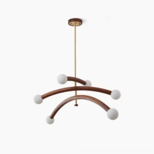 Branch Molecular Chandelier frontal view showing six curved walnut wood arms with matte white glass globe bulbs and brushed brass hardware against white studio background