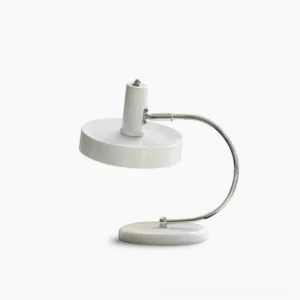 Brano minimalist white table lamp with chrome curved arm and cylindrical shade, front studio view