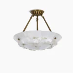 Brass and alabaster bowl pendant lamp overhead view showing fluted brass frame and natural stone diffuser