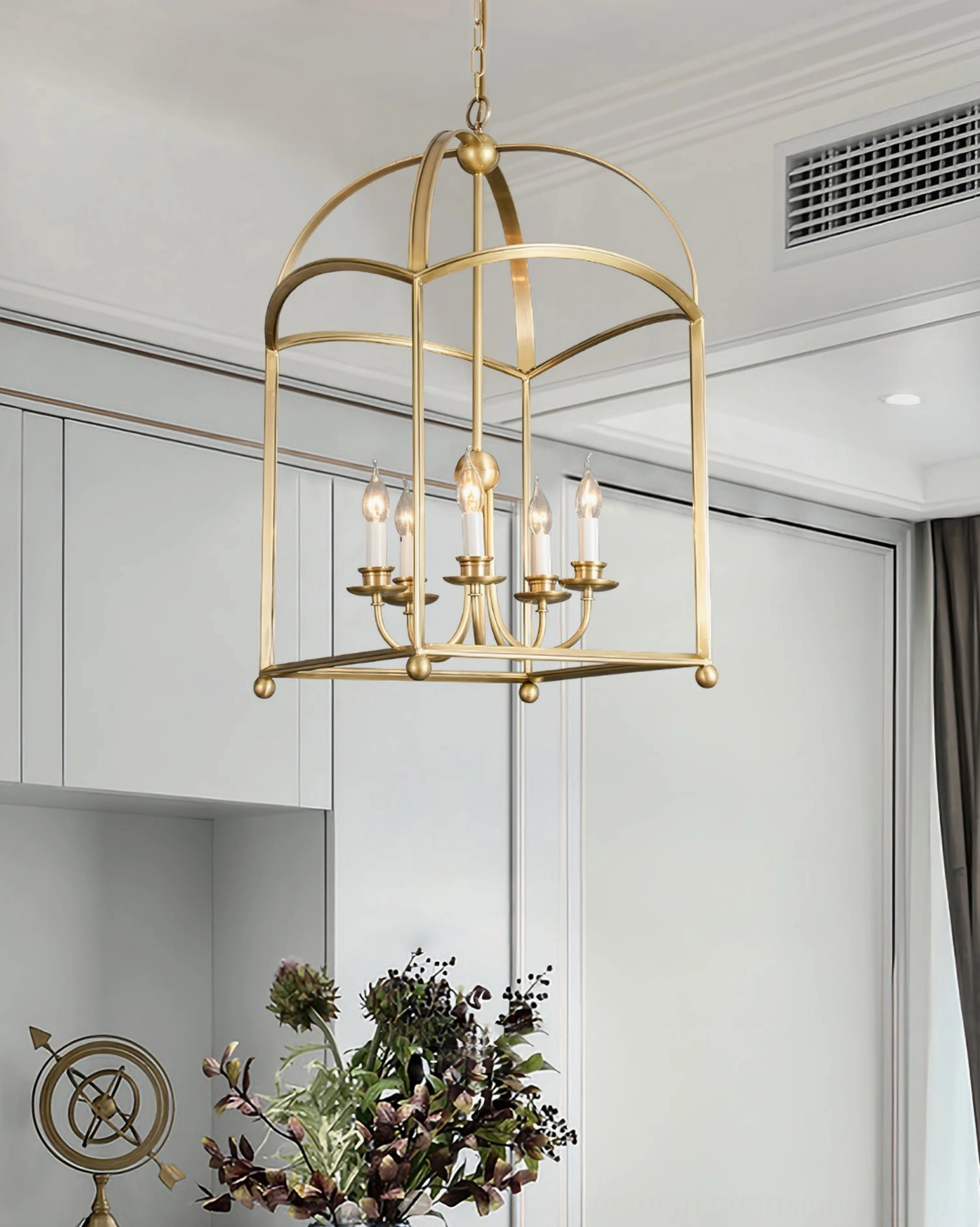 Brass arch lantern pendant chandelier installed in modern dining room
