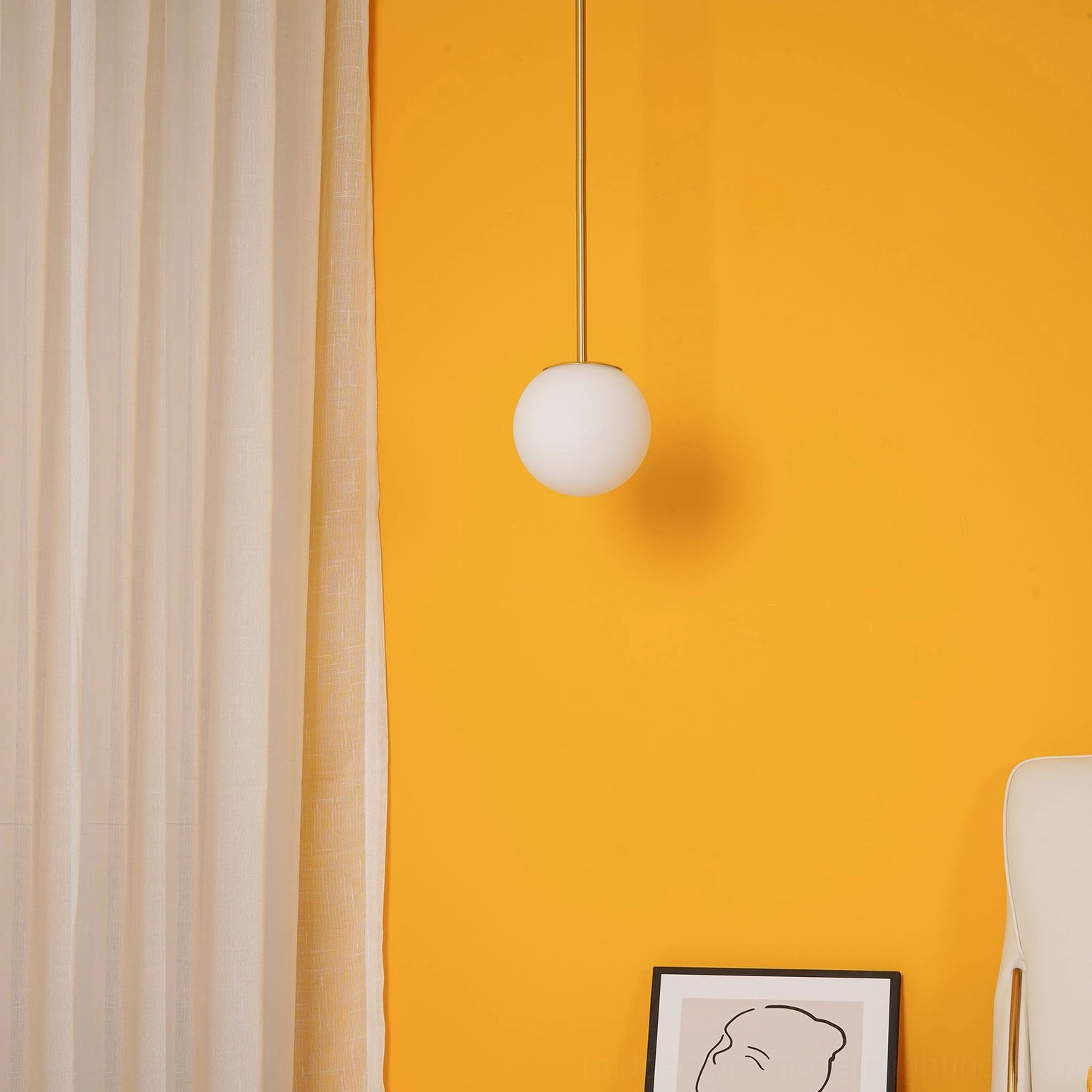 Brass architectural pendant suspension fixture demonstrating clean minimalist design lines