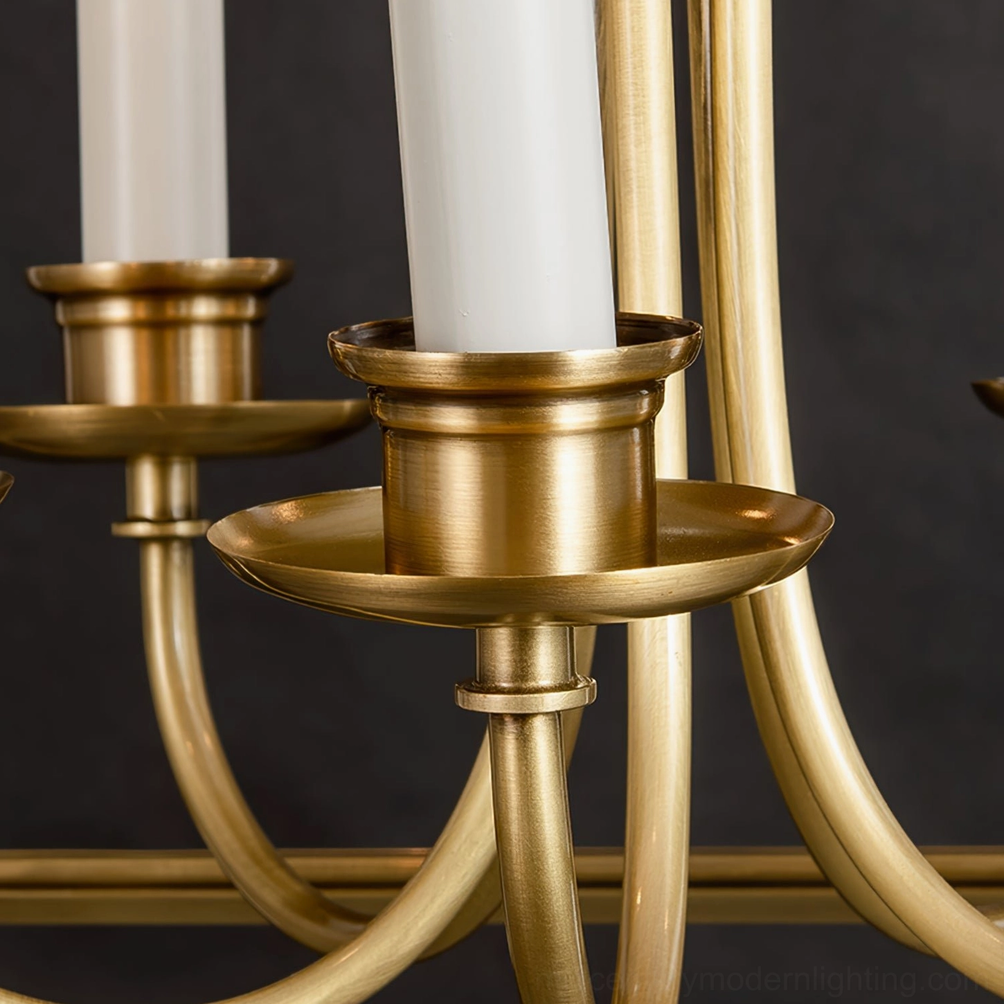 Detailed close-up of brass candle socket and drip tray candlestick design
