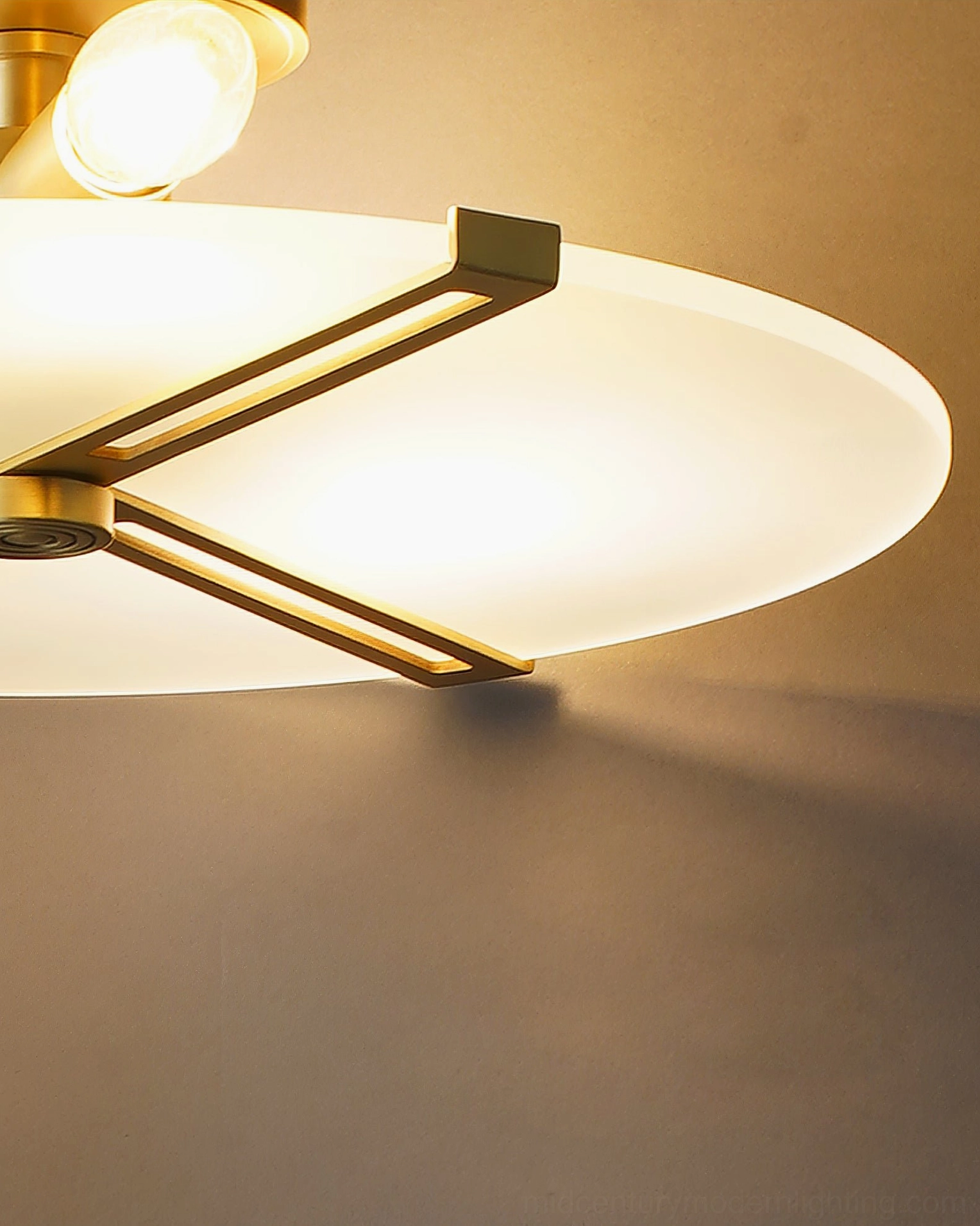 Brass ceiling lamp fixture providing warm ambient light in modern living space