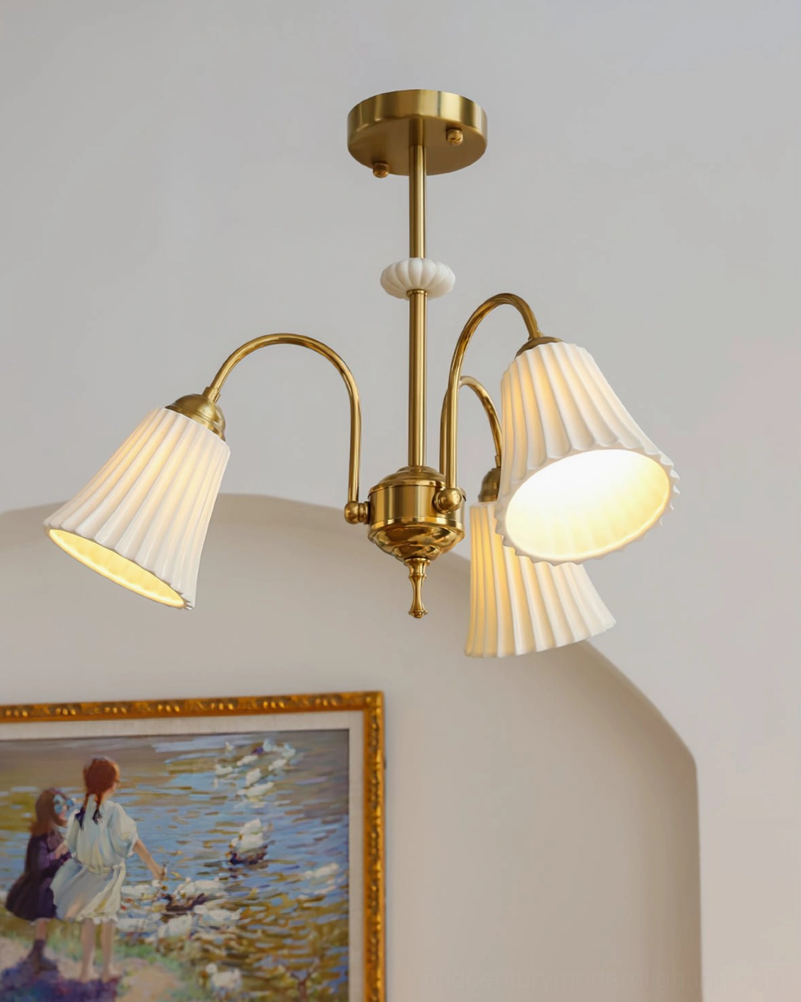 3-head brass chandelier with pastoral vintage aesthetic in archway with landscape art, soft warm glow illuminating mid-century modern design