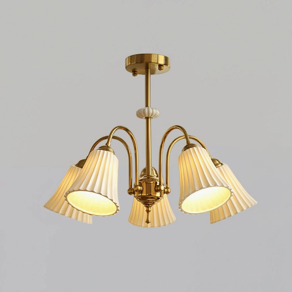 Brass pendant chandelier creating focal point lighting in decorated vintage interior space, demonstrating design versatility and style impact
