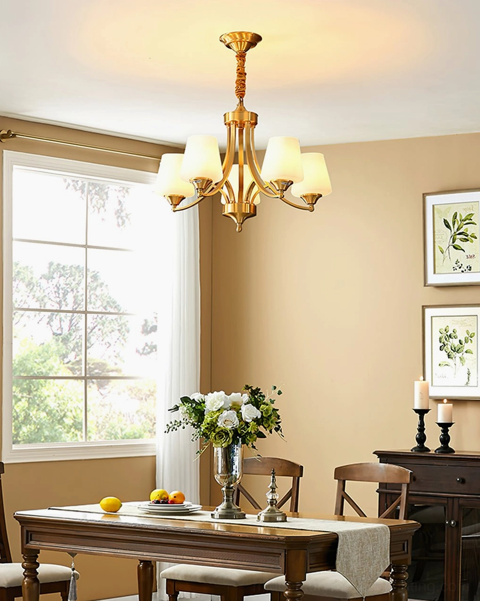 Tuileries 8-light brass chandelier in formal dining room above wooden table with fruit centerpiece