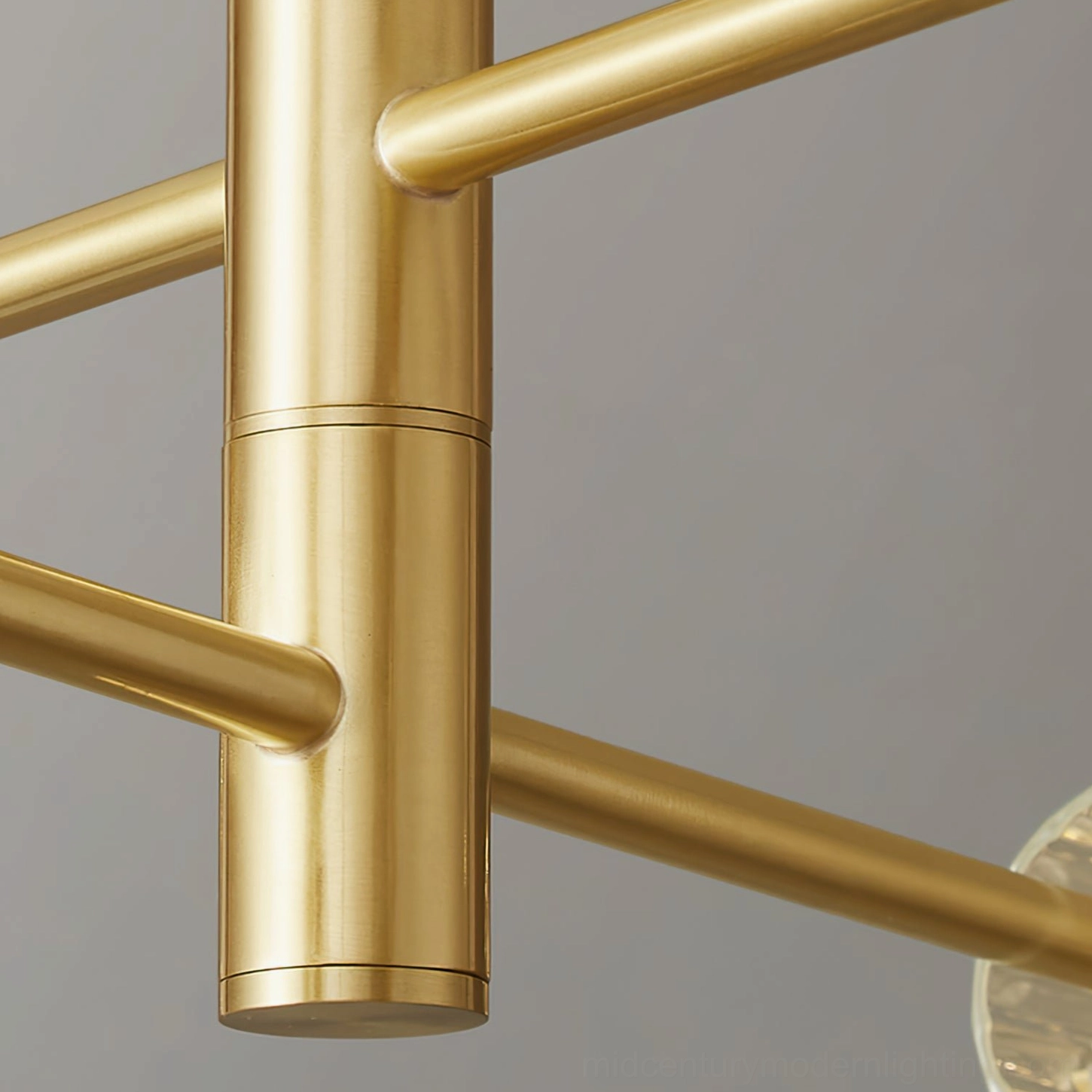 Brass gold chandelier frame joint polished metal tubular arm connector detail