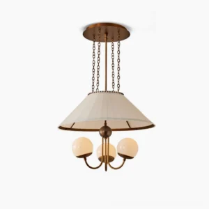 Antique bronze brass chandelier with pleated shade and three globe glass bulbs, front studio view