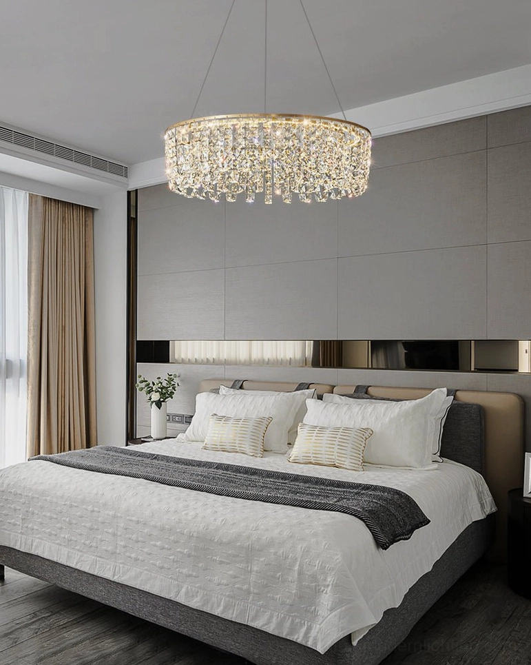 Brass chandelier with clear crystals creating prismatic light patterns in interior space