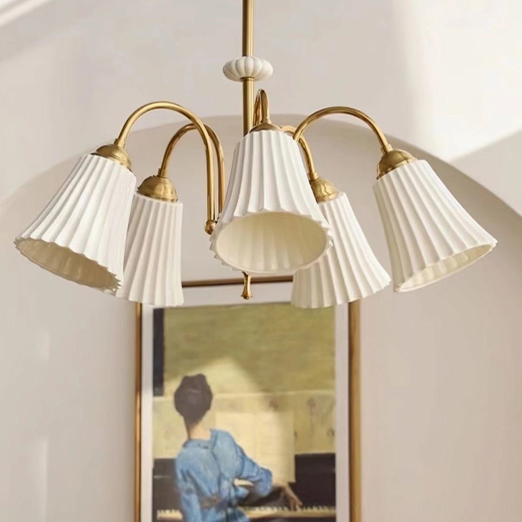 Brass pendant chandelier installed in contemporary interior showing scale and proportions relative to modern furniture and décor styling