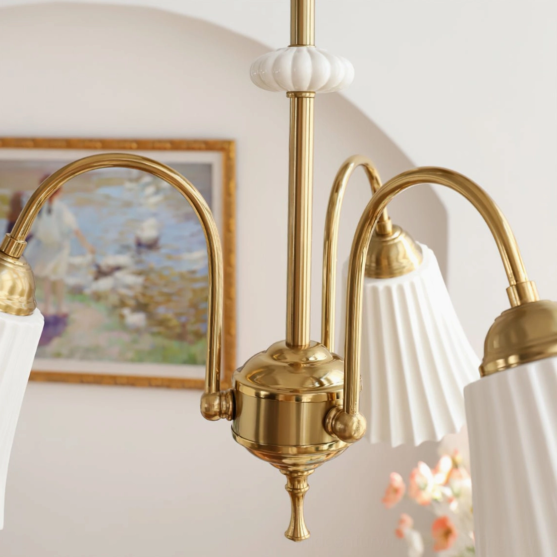 Side profile view of brass pendant chandelier demonstrating elegant lines and proportions of pleated glass shades and brass suspension