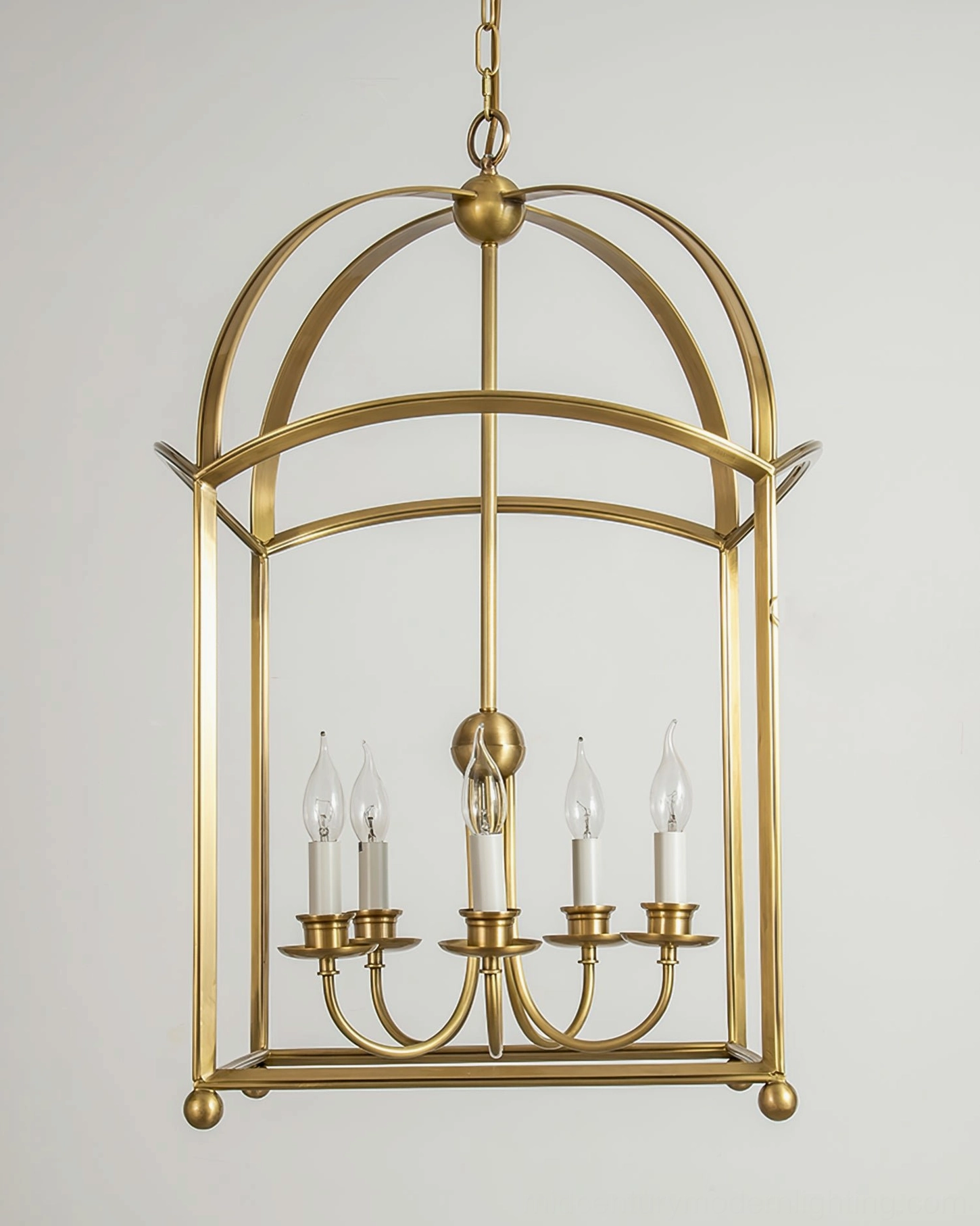 Underside view of brass cage chandelier open metal frame candle sockets