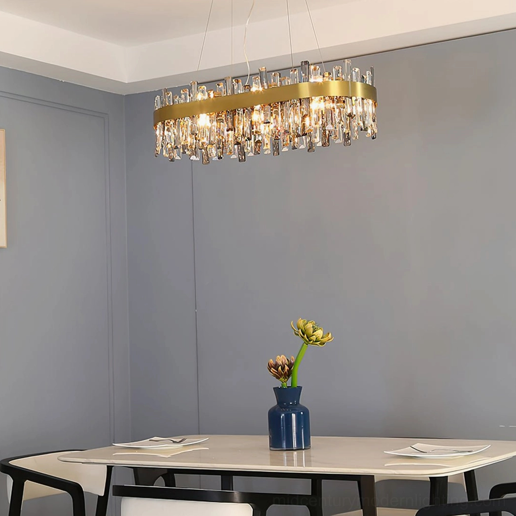 Brass metal crystal chandelier in elegant dining room setting with warm ambient lighting and decor