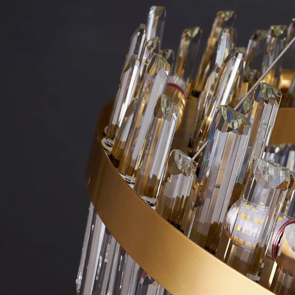 Brass crystal chandelier architectural detail showing metal frame construction and crystal suspension system