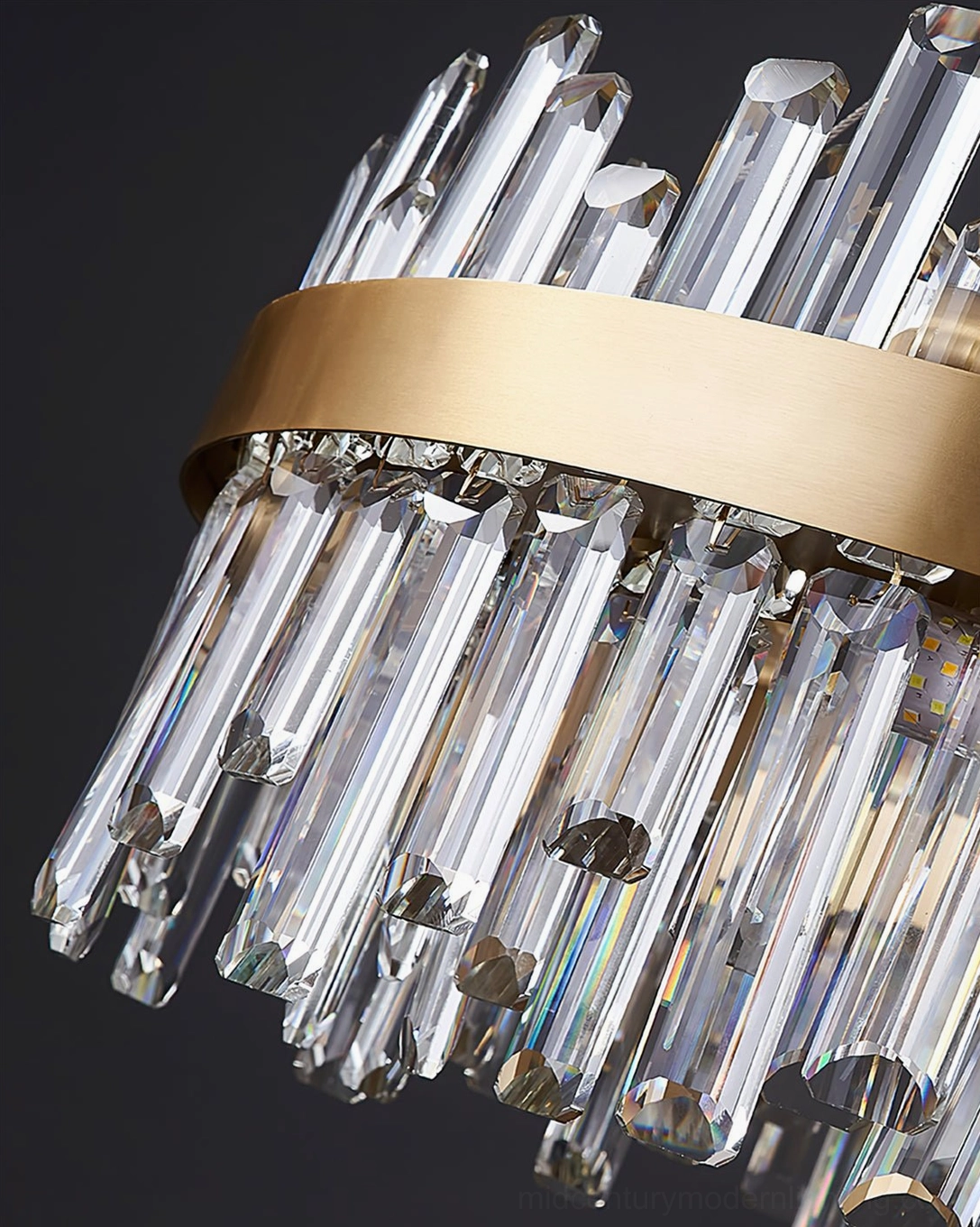 Contemporary brass crystal chandelier installed in modern interior creating focal point lighting effect