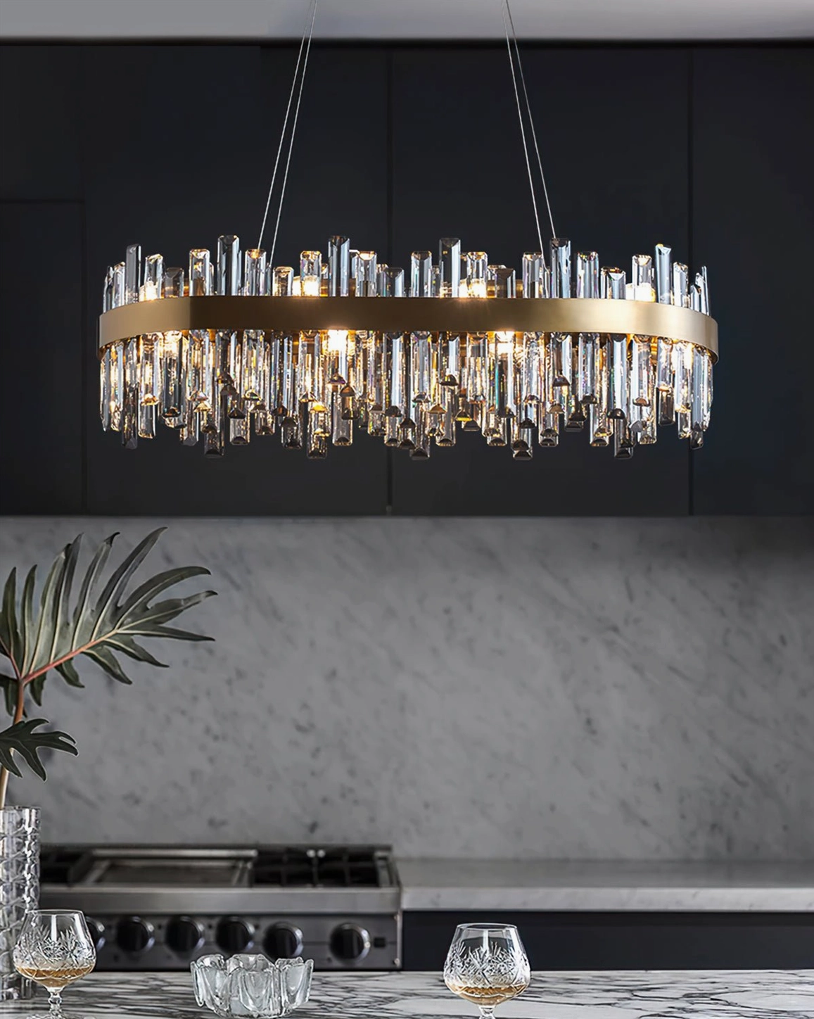Brass crystal chandelier design detail showing pendant crystals and gold metal suspension framework