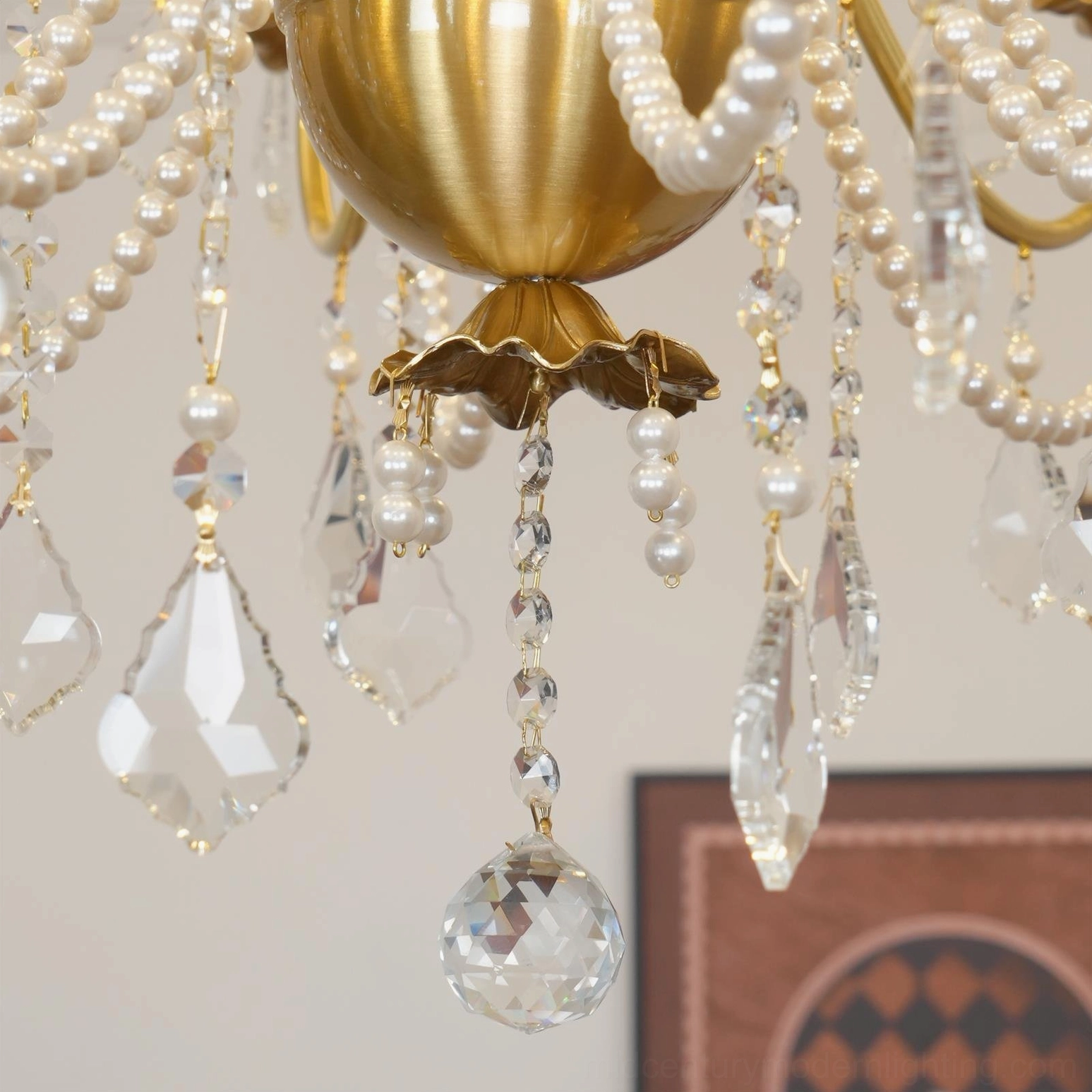 Decorative brass and crystal chandelier showcasing polished metalwork and premium crystal craftsmanship
