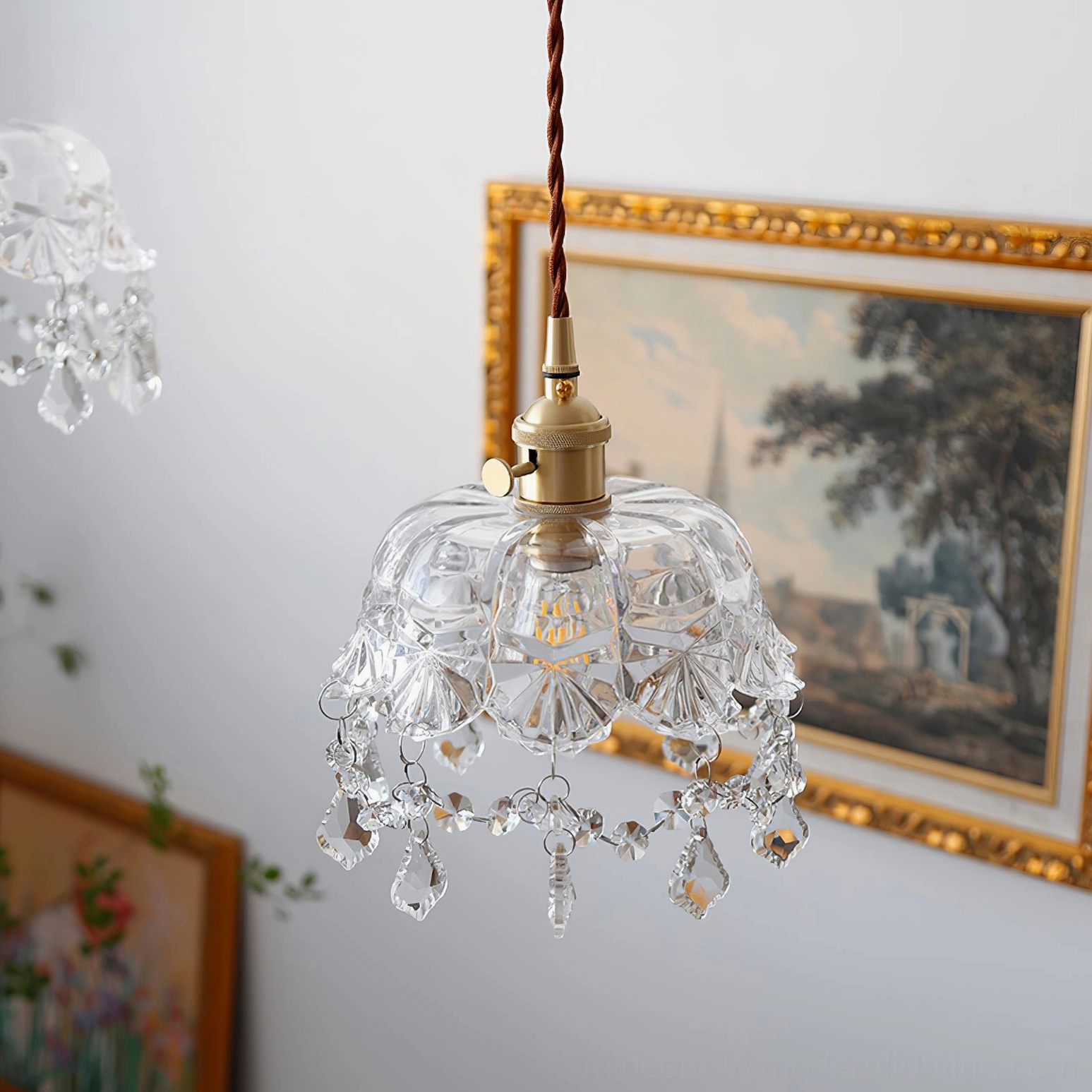 Brass crystal pendant light, close-up of glass dome and metal hardware assembly