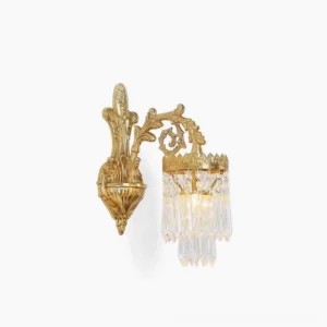 Brass crystal wall sconce with carved foliage details and tapered crystal prism shade, polished gold finish front view