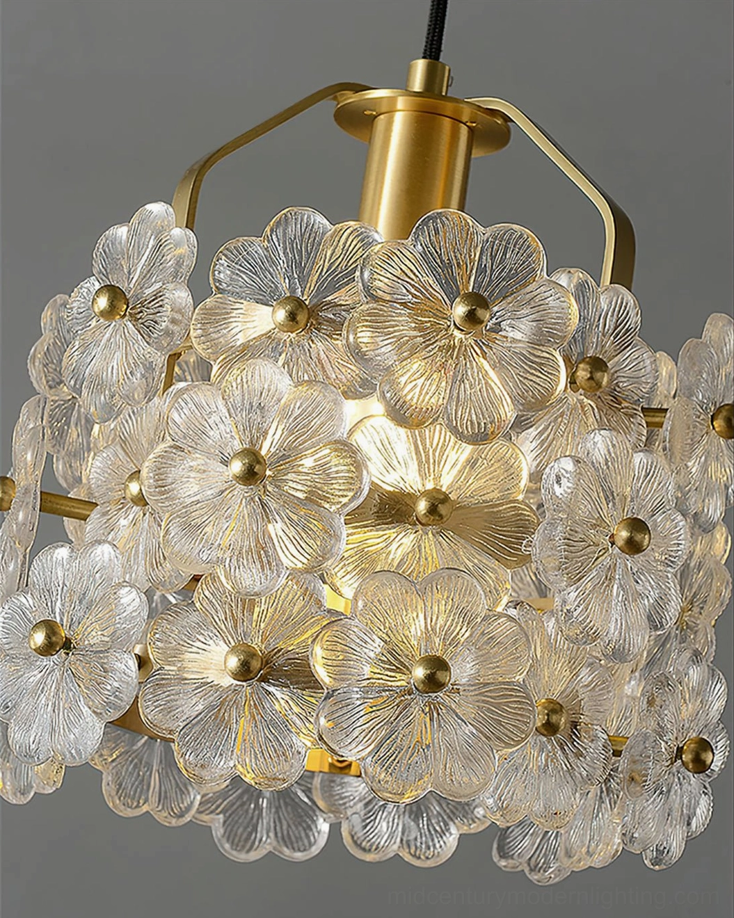 Brass frame floral pendant creating ambient glow in contemporary living space interior environment