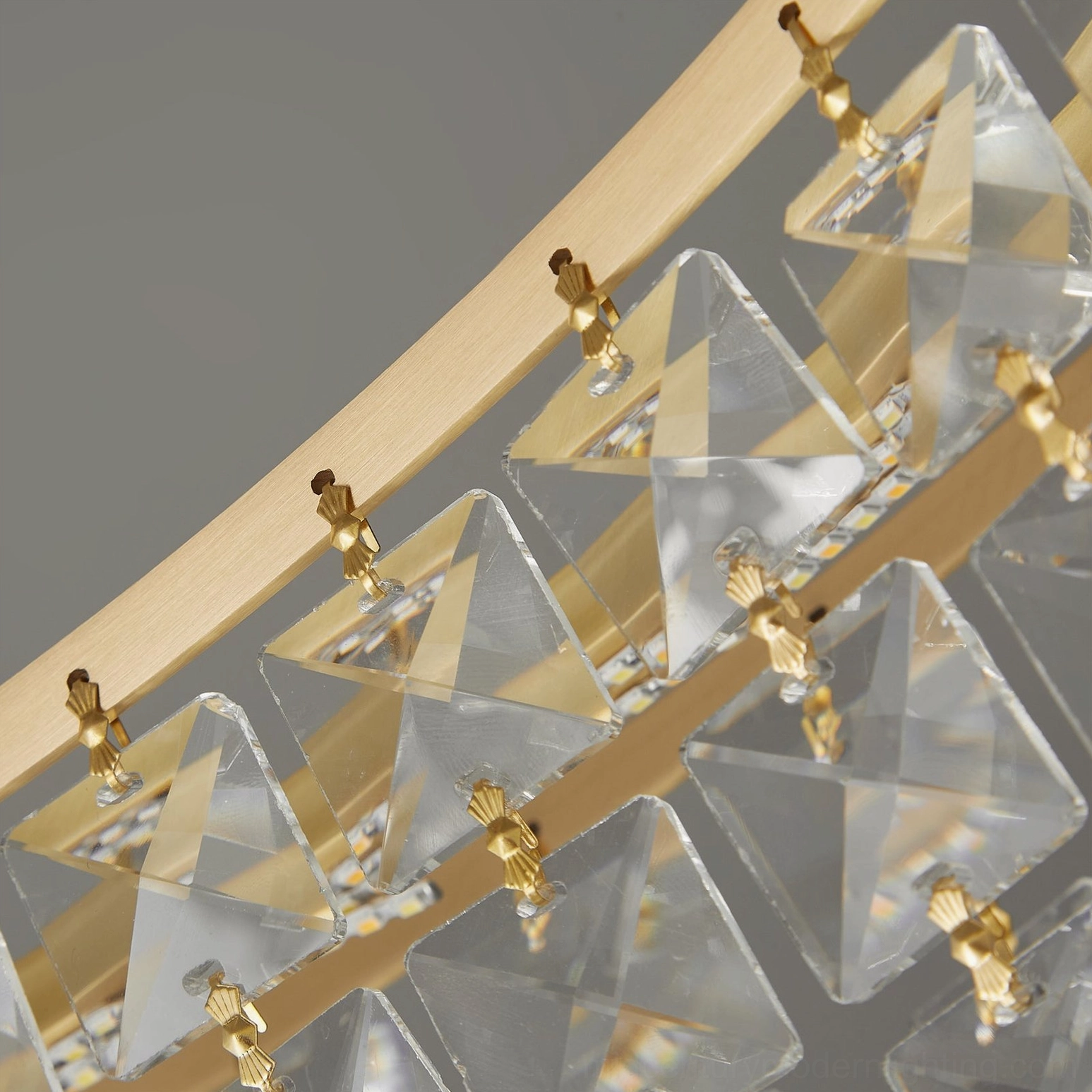 Brass ring frame and crystal mounting clips showing construction quality and geometric design