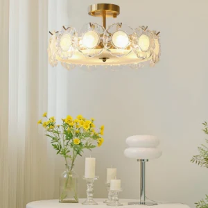 Elegant brass ceiling lamp illuminated in cozy home setting with flowers, candles and warm vintage decor