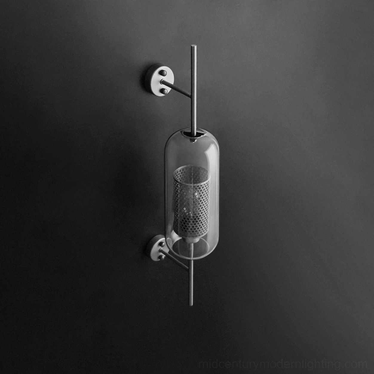 Glass wall sconce with warm brass finish and sculptural glass shade form