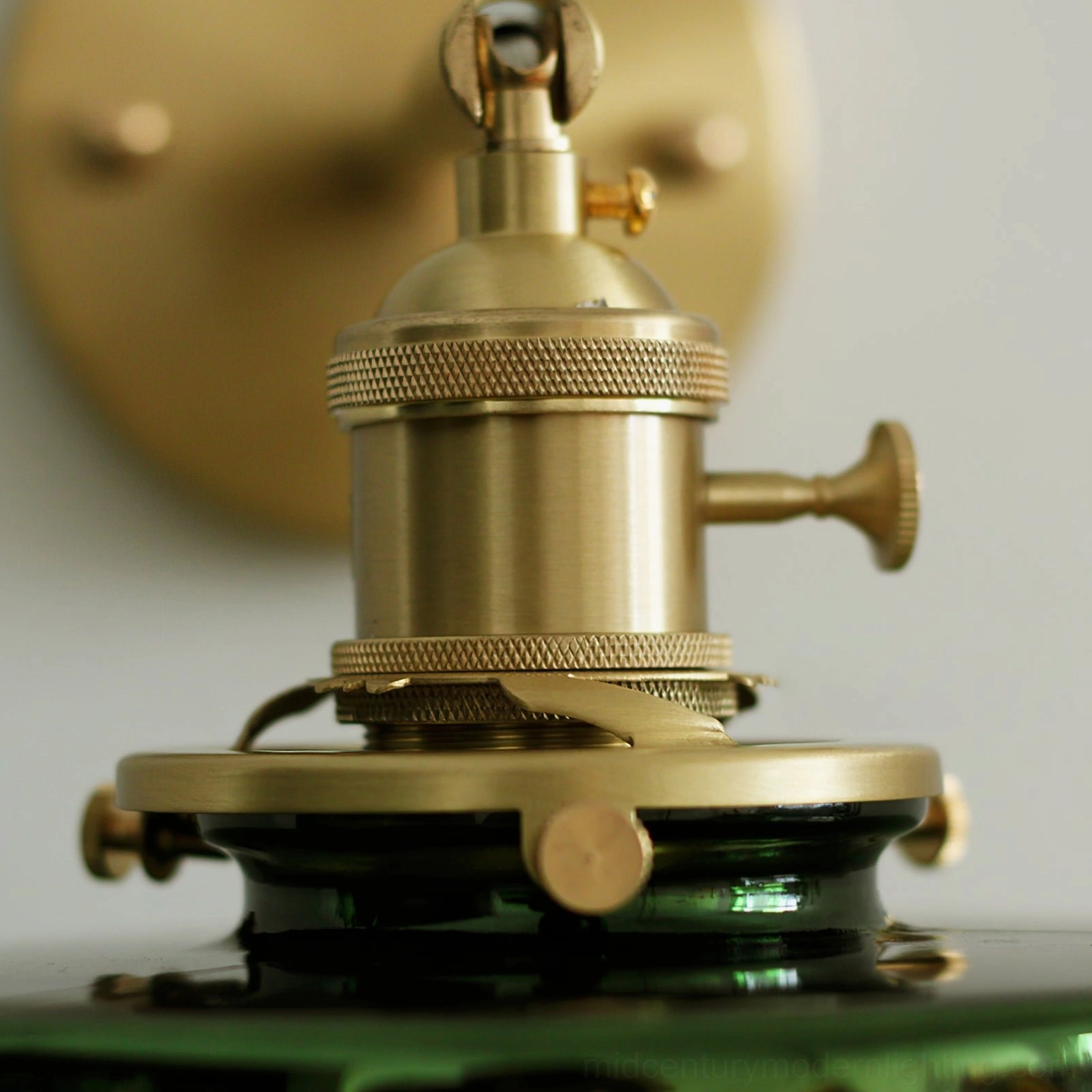 Brass gold metal base and hardware close-up with knurled vintage industrial design details