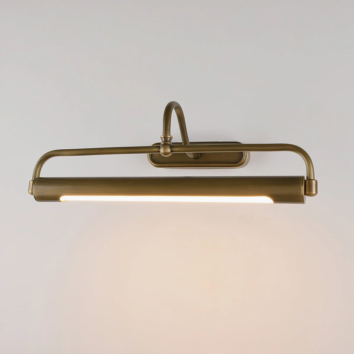 Polished brass gooseneck sconce mounted above vanity mirror, practical bathroom lighting