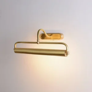 Polished brass wall sconce with curved gooseneck arm casting warm light, three-quarter angle