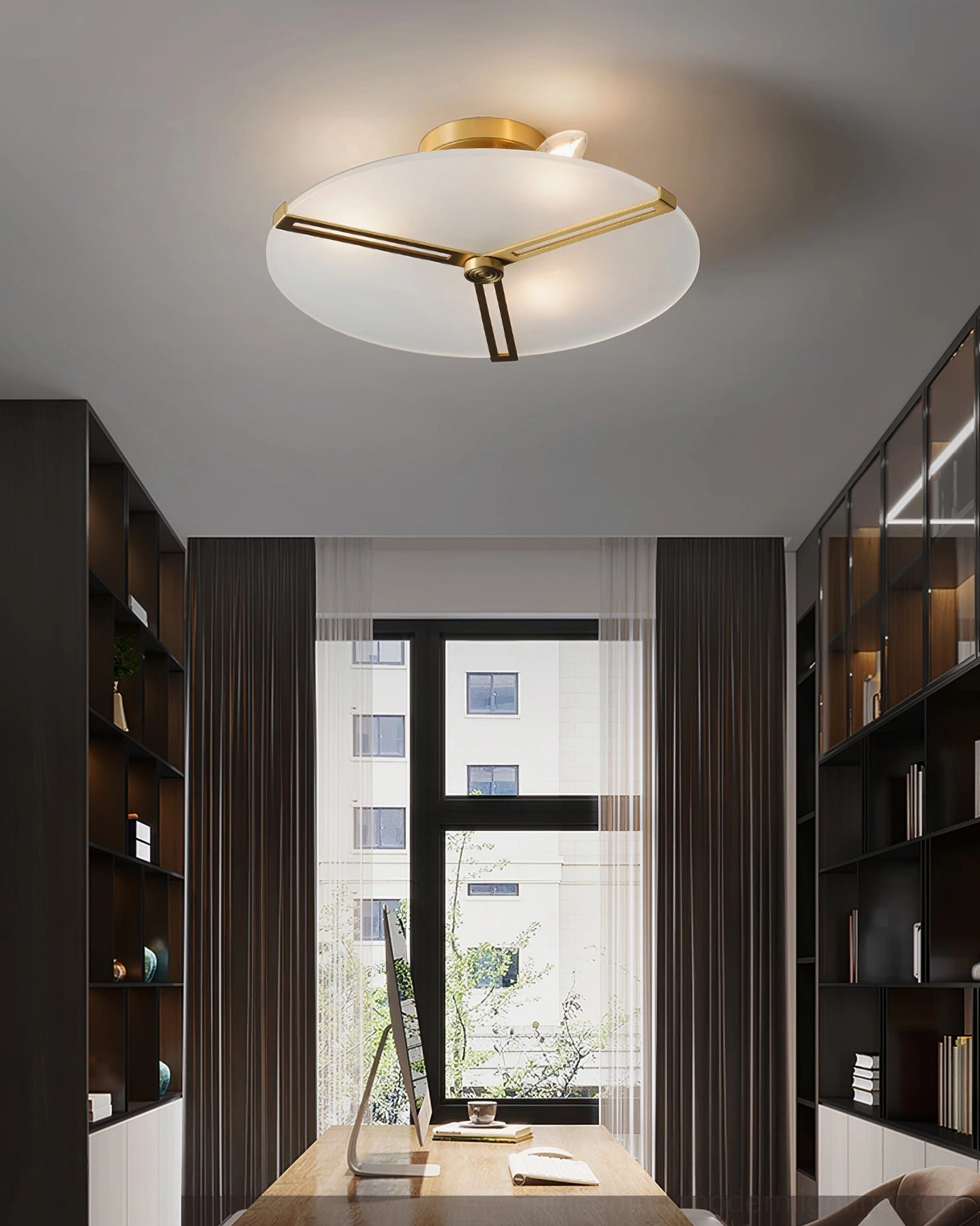 Geometric brass ceiling lamp illuminated in modern home office surrounded by bookshelves