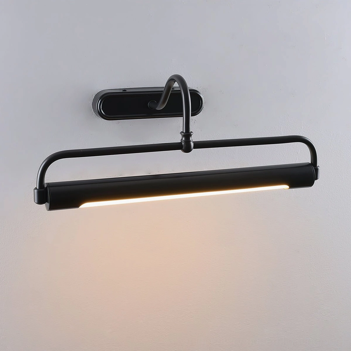 Brass wall sconce oval backplate design, elegant curved arm projection
